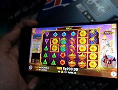 Makalah Judi Slot Online